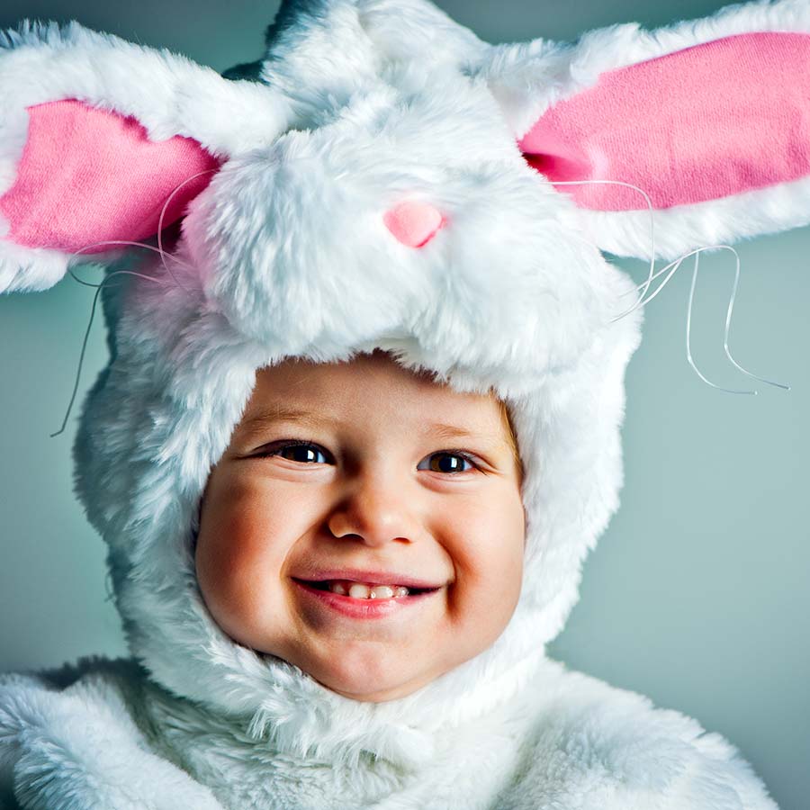 Smiling child in bunny costume