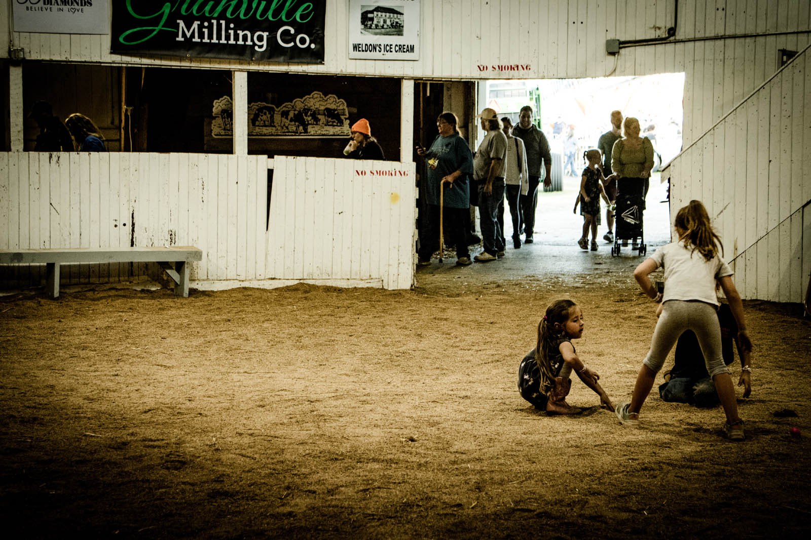 Children playing inside the round barn during the 2023 Fairfield County Fair in Lancaster, Ohio.